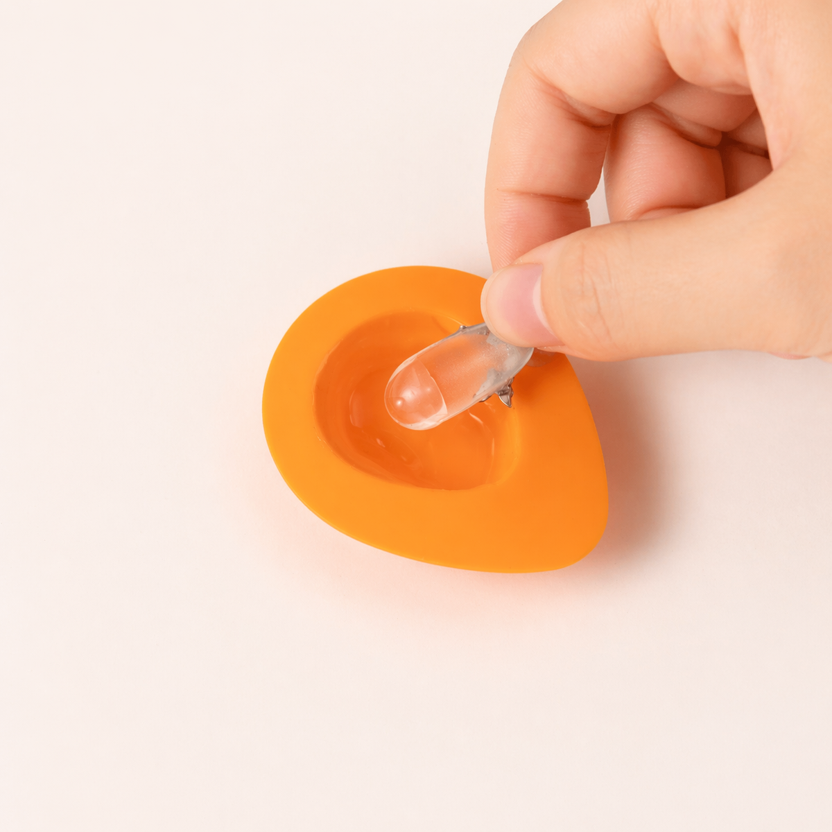 Removing a nail tip from the adhesive gel pad